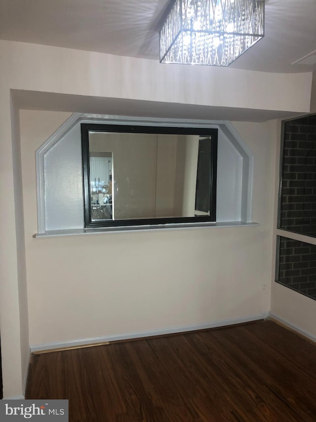 bonus room with dark hardwood / wood-style flooring