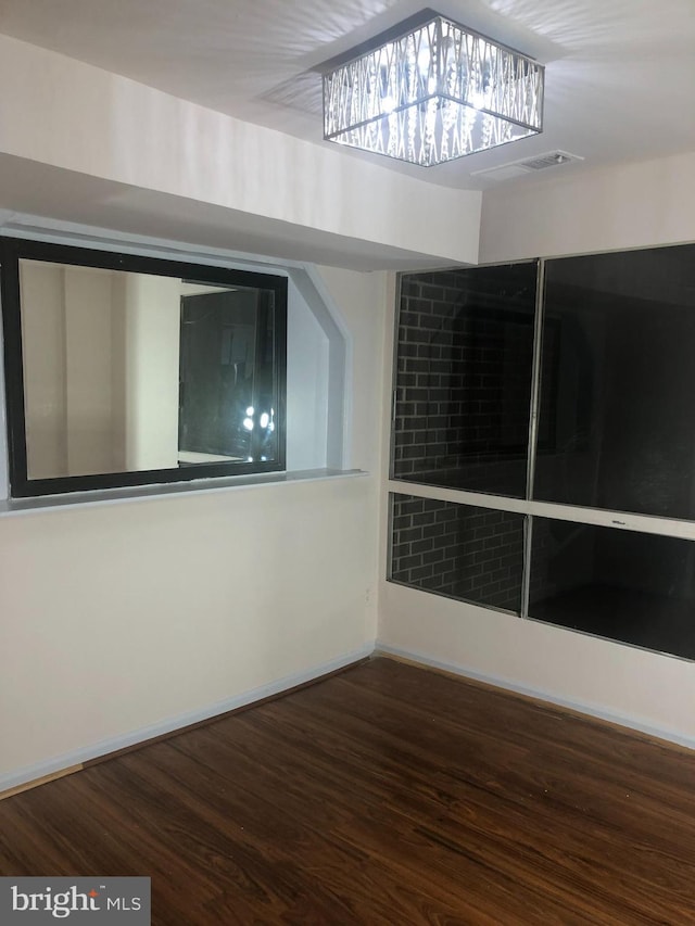 unfurnished room featuring hardwood / wood-style floors