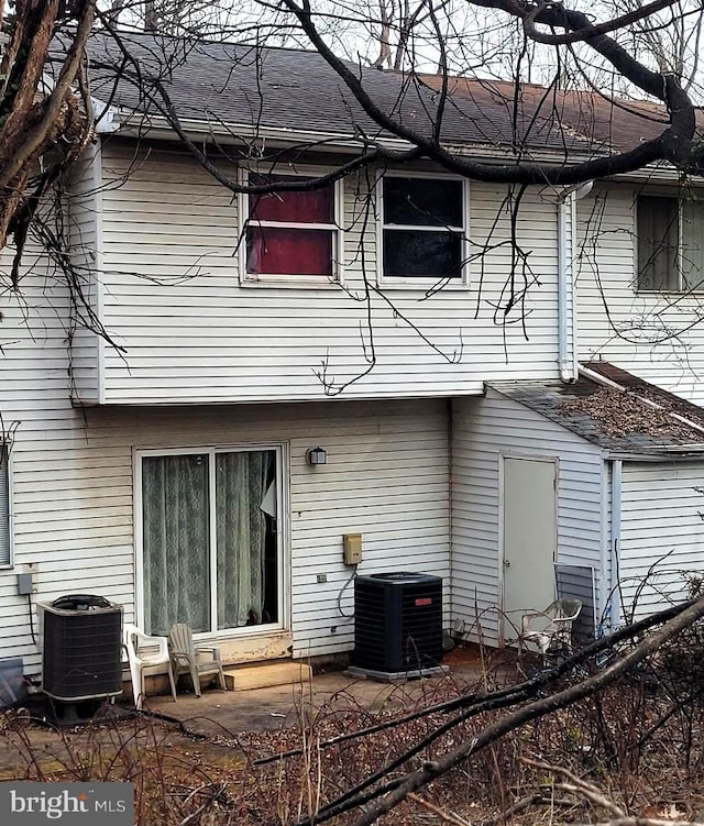 back of property featuring a patio and cooling unit