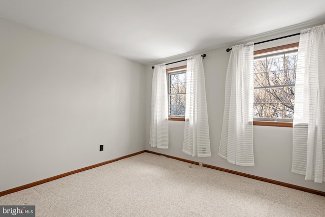 unfurnished room with carpet flooring