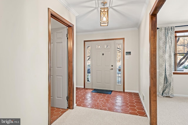 foyer featuring carpet and crown molding