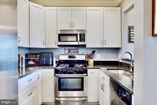 kitchen featuring sink, white cabinetry, and stainless steel appliances