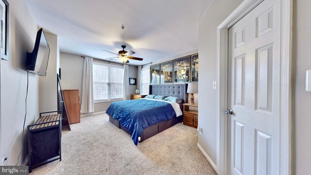 bedroom featuring ceiling fan and light colored carpet