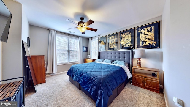 bedroom featuring ceiling fan and light colored carpet