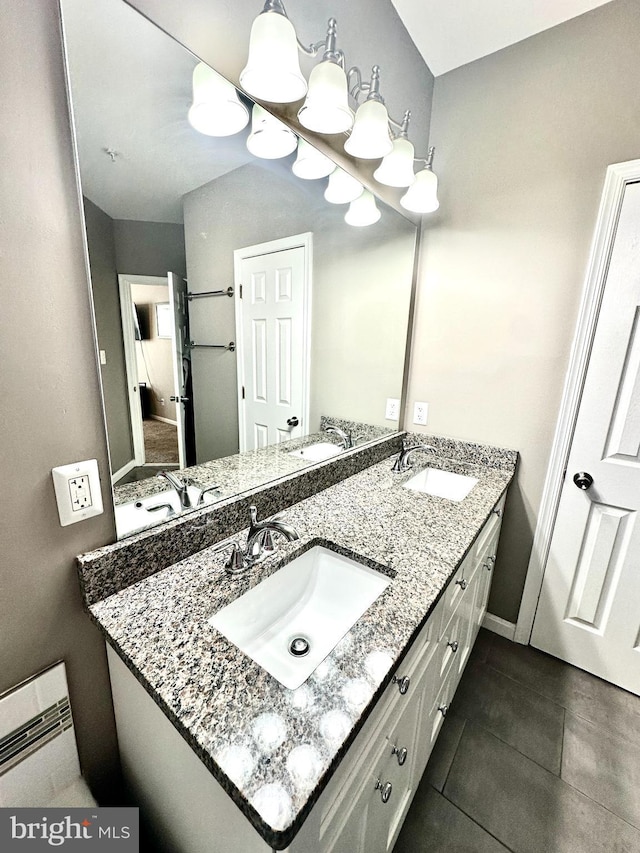 bathroom featuring tile patterned floors and vanity