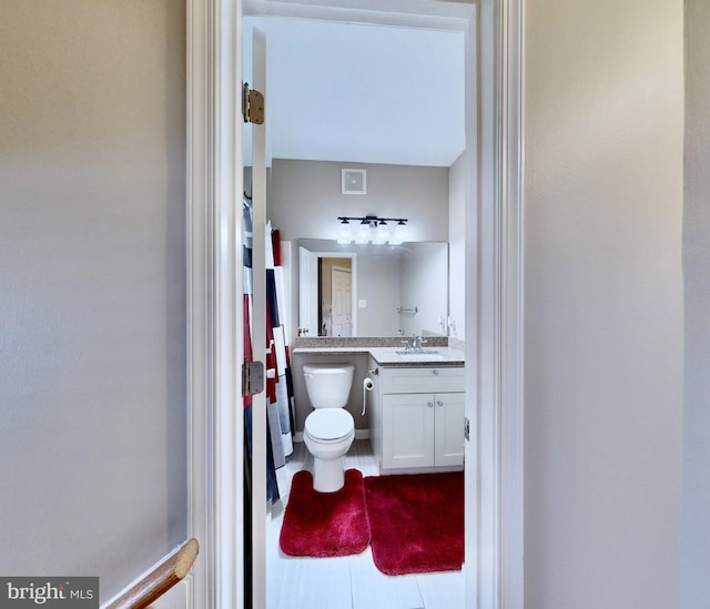 bathroom with vanity and toilet