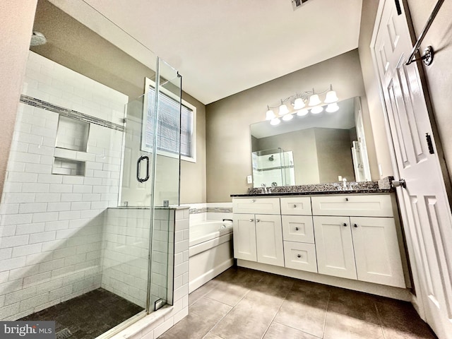 bathroom with tile patterned flooring, vanity, and shower with separate bathtub