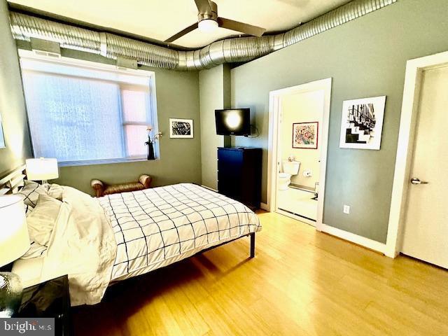 bedroom with light hardwood / wood-style floors and ceiling fan