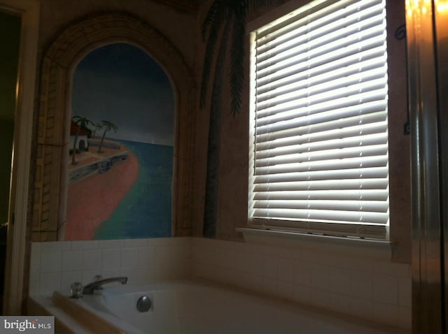 bathroom featuring tiled bath