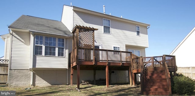 rear view of property with a deck