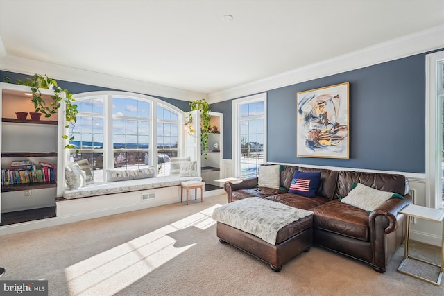 living room with light colored carpet and crown molding