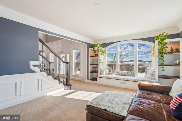 carpeted living room with crown molding