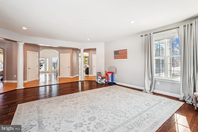 rec room with hardwood / wood-style floors and a healthy amount of sunlight