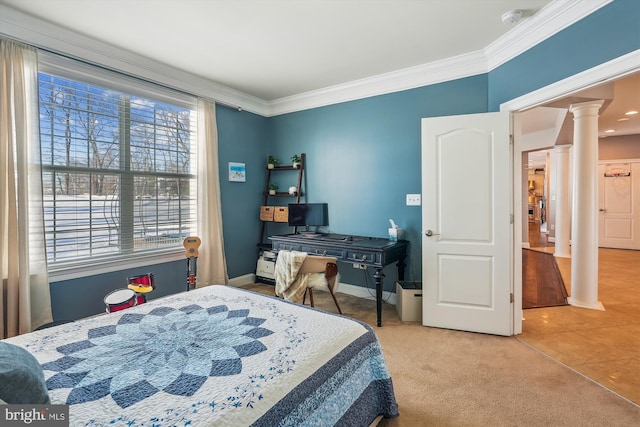 carpeted bedroom featuring decorative columns and ornamental molding