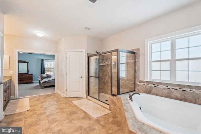 bathroom with separate shower and tub and vanity