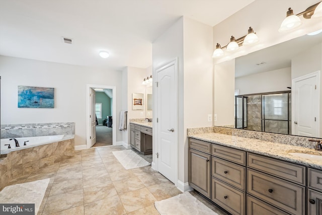 bathroom with tile patterned flooring, shower with separate bathtub, and vanity