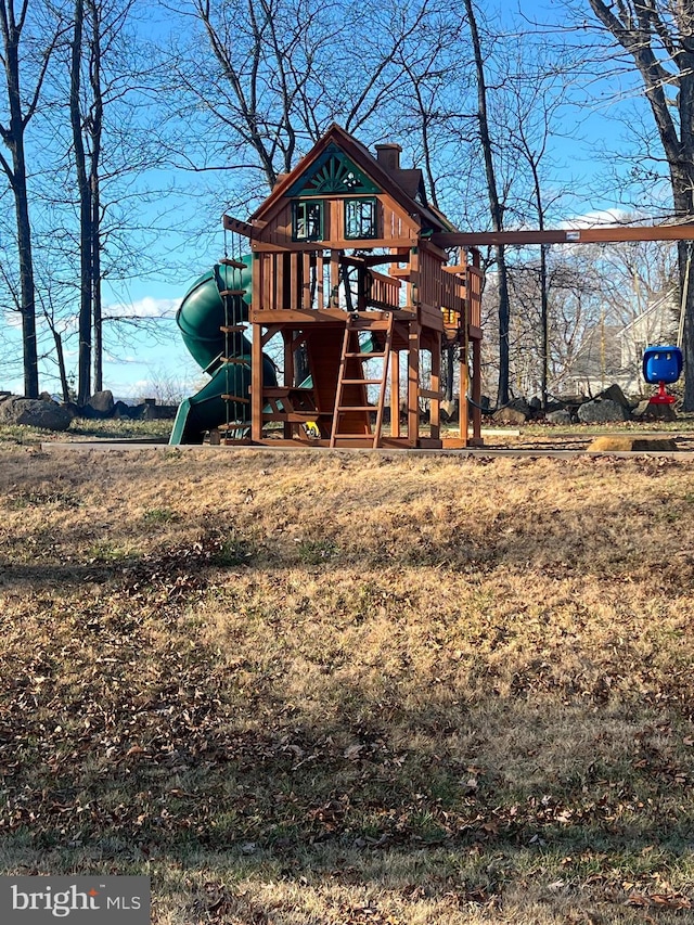 back of house featuring a playground