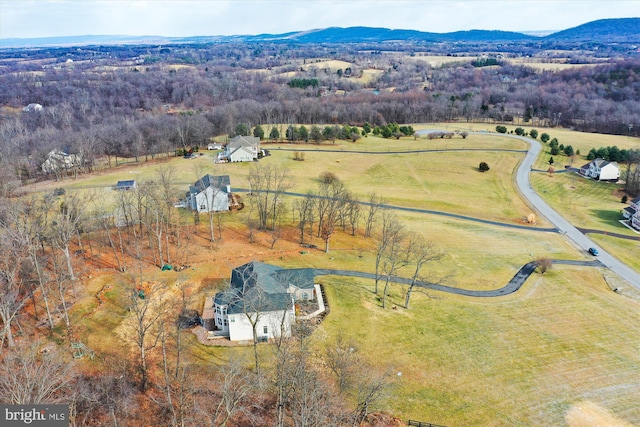 drone / aerial view featuring a rural view and a mountain view