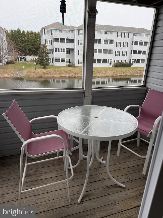 wooden deck with a water view