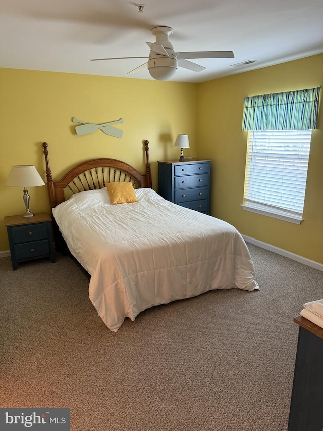 bedroom with ceiling fan and carpet floors