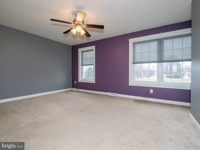 carpeted empty room with ceiling fan