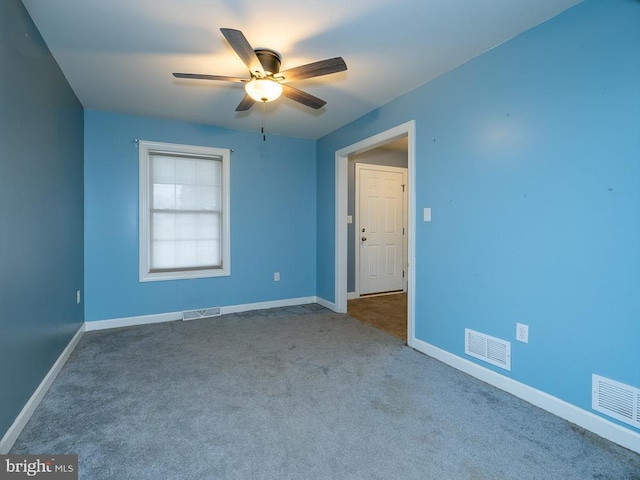 carpeted empty room with ceiling fan