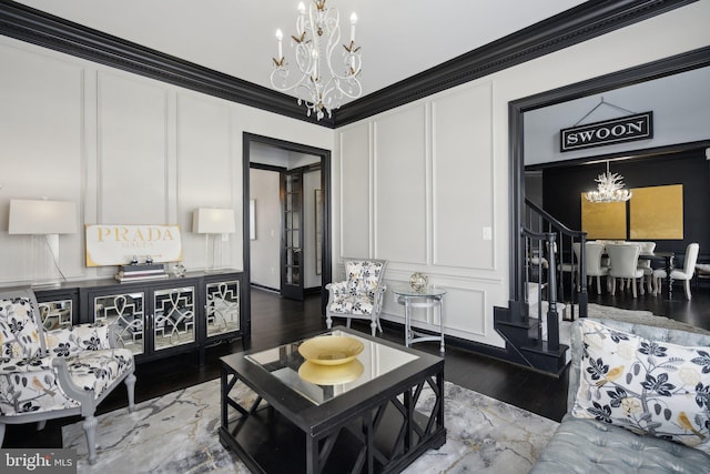 living room with wood-type flooring and ornamental molding