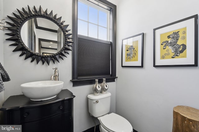 bathroom featuring vanity and toilet