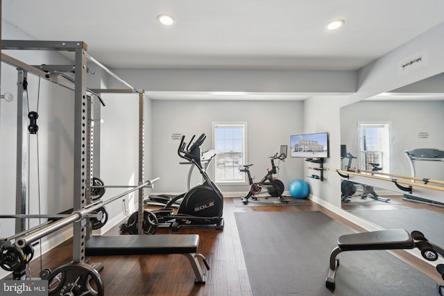 exercise room featuring dark wood-type flooring