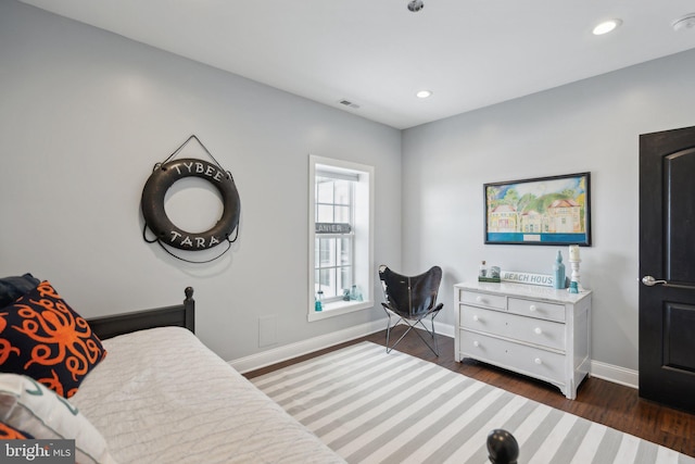 bedroom featuring dark wood-type flooring