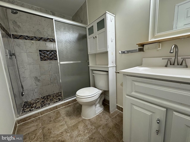 bathroom with vanity, toilet, and walk in shower