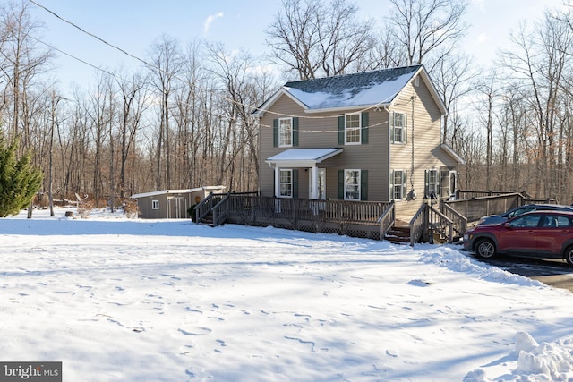 front of property featuring a shed