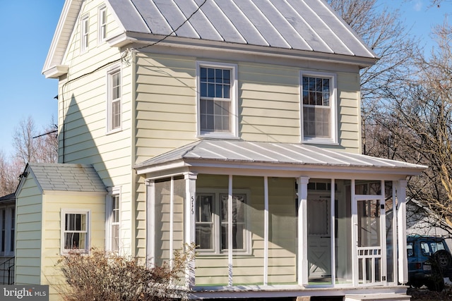 view of front of property with a sunroom