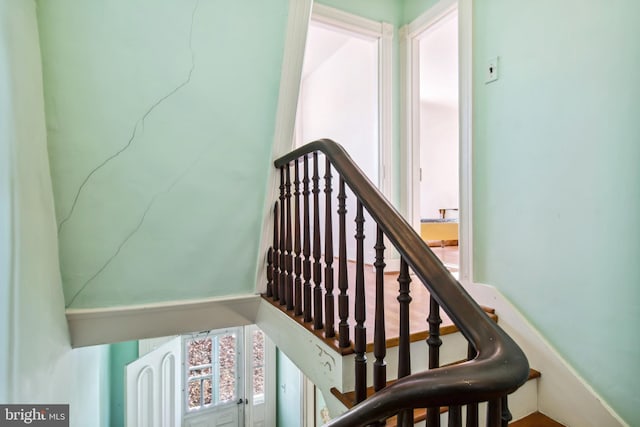 staircase featuring plenty of natural light