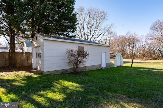 view of outbuilding with a lawn