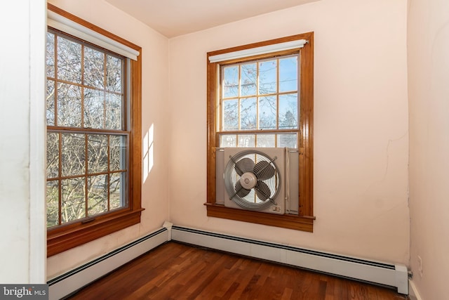 interior details featuring hardwood / wood-style flooring and baseboard heating