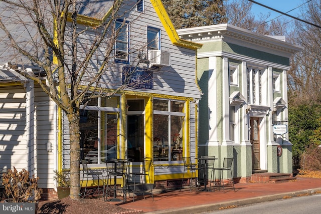 view of home's exterior with a sunroom