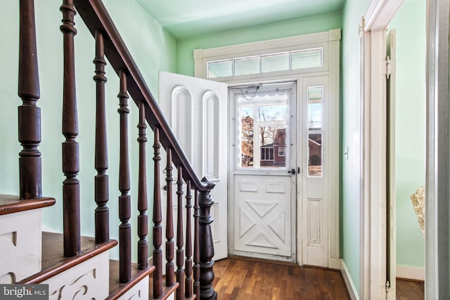 entryway with dark wood-type flooring