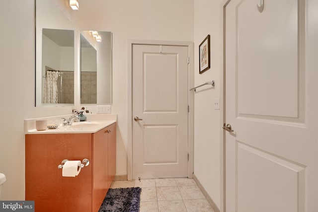 bathroom featuring tile patterned floors, a shower with curtain, and vanity