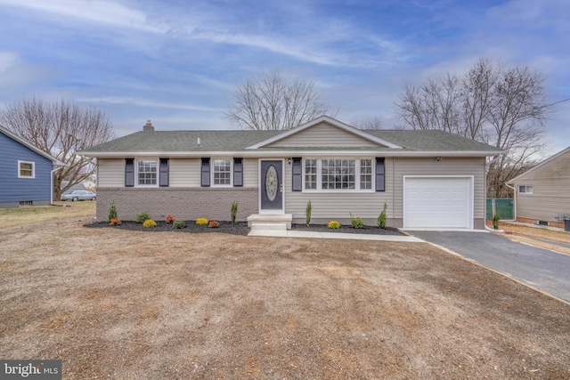 ranch-style home featuring a garage