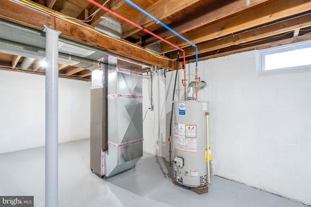 basement featuring heating unit and water heater