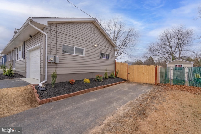 view of side of property featuring a garage