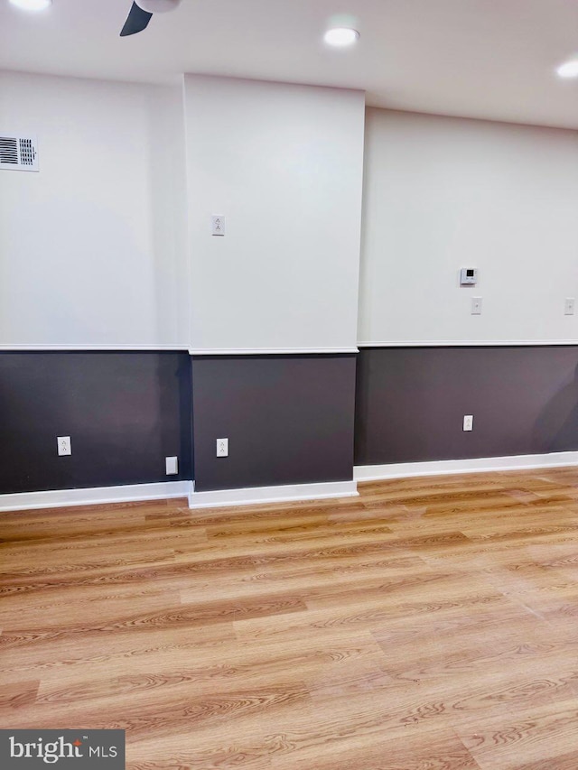 spare room with ceiling fan and light hardwood / wood-style floors