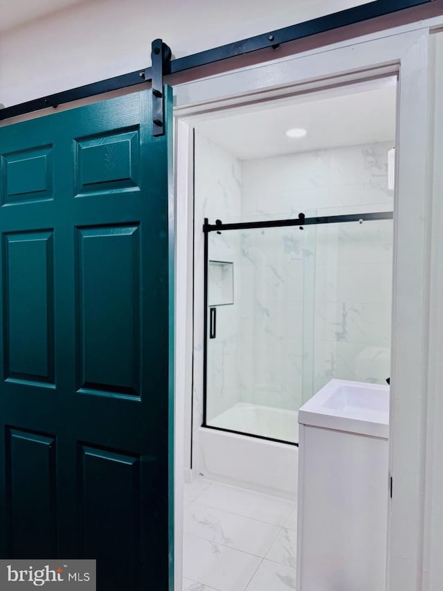 bathroom featuring bath / shower combo with glass door