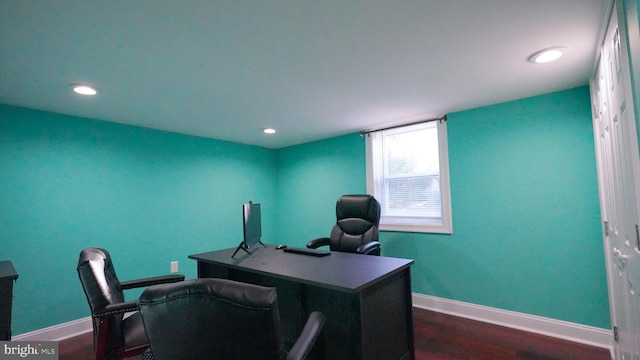 home office with dark wood-type flooring