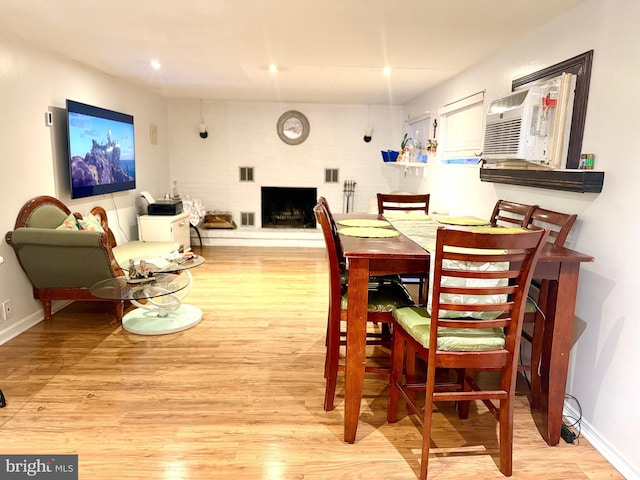 dining space with light hardwood / wood-style flooring