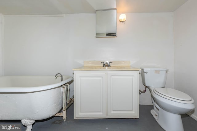 bathroom with a bathtub, toilet, concrete flooring, and vanity