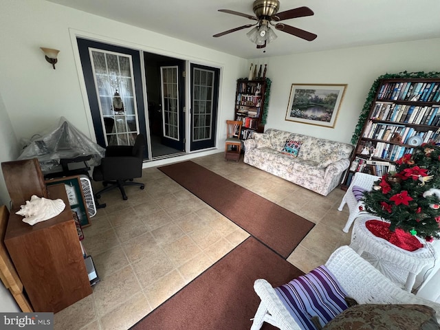 tiled living room with ceiling fan