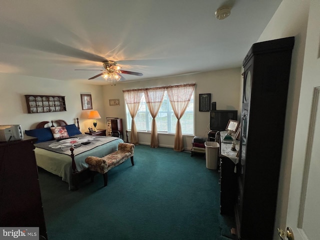 bedroom featuring ceiling fan and dark colored carpet