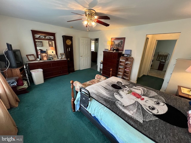 bedroom with ceiling fan and dark carpet